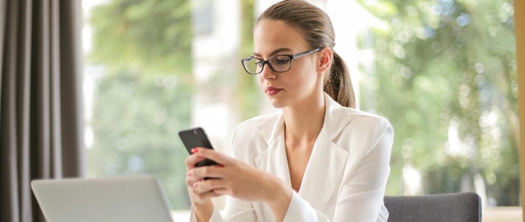 Attendee woman updating her profile's personal information using EventMobi's Event App.