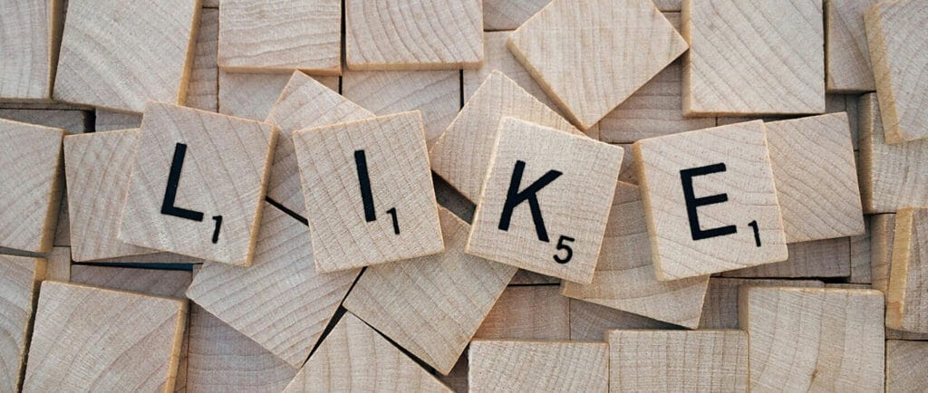 Wooden blocks forming the word "like" - an abstract way of representing social media.