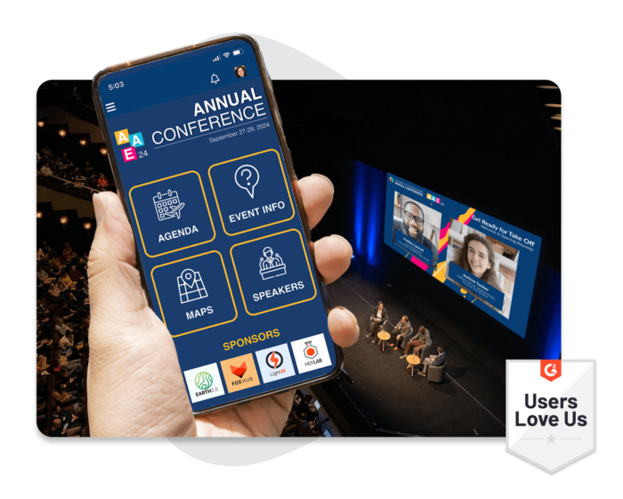 A hand holding a mobile phone that shows an in-person Annual Conference’s event homepage. A G2 badge showing that users love using EventMobi.